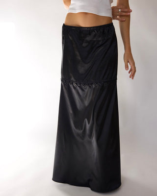 Young woman wearing the long version of the STOW Apparel black Gemini Skirt.