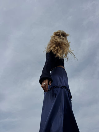 Young woman wearing STOW Apparel Gemini skirt that was hand-made in new york city. 